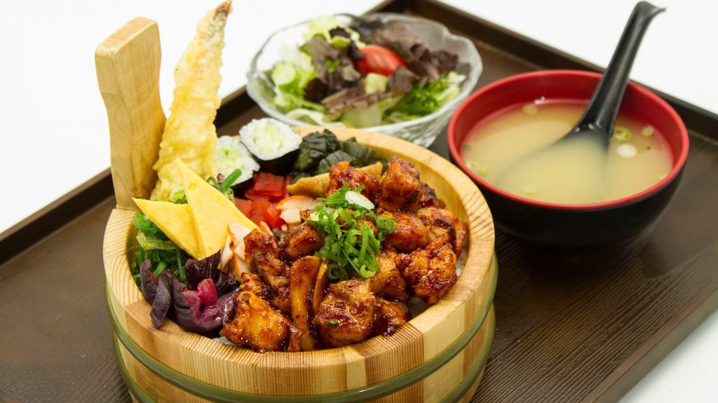 Karaage Ekiben · Spicy soy ginger deep fried chicken with Japanese style side dishes over rice.