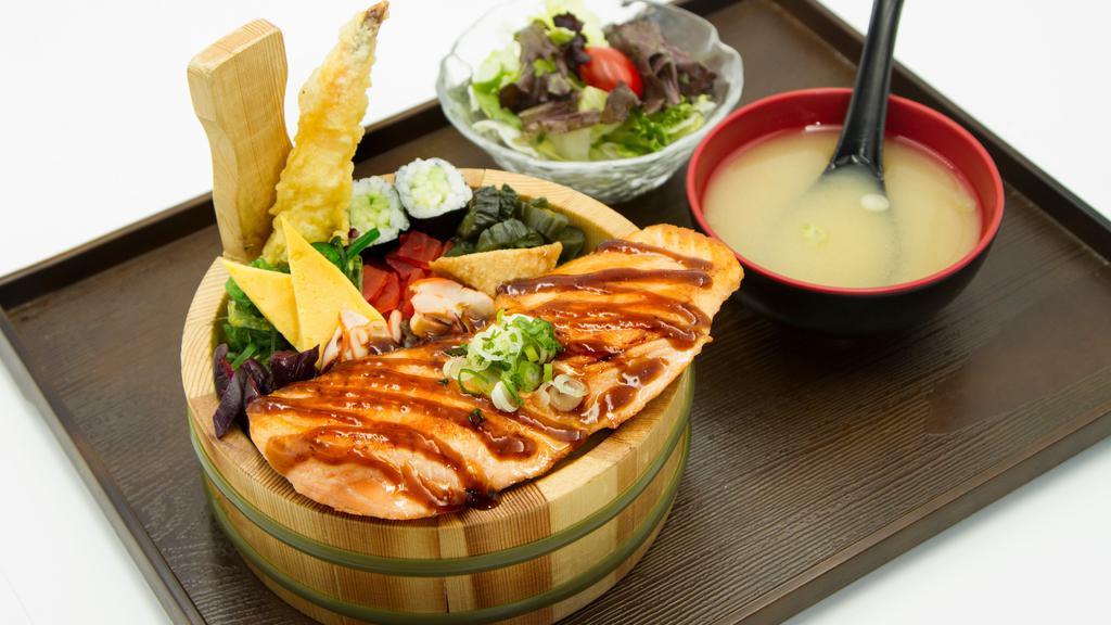 Salmon Teriyaki Ekiben · Grilled salmon with Japanese style side dishes over rice.