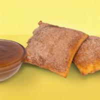 Sopapillas With Caramel Sauce · Mexican pastries coated in cinnamon-sugar. Served with caramel sauce for dipping