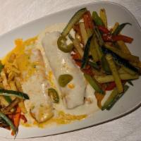Veggie Enchiladas · Two cheese enchiladas topped with veggies. Served with rice and beans.