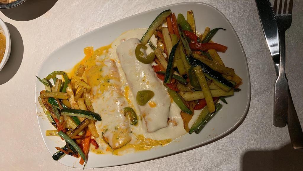 Veggie Enchiladas · Two cheese enchiladas topped with veggies. Served with rice and beans.