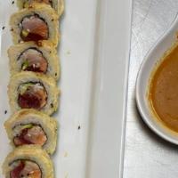 Texas Roll · Raw. Salmon, tuna, yellowtail, masago, avocado tempura style with special sauce. Spicy.