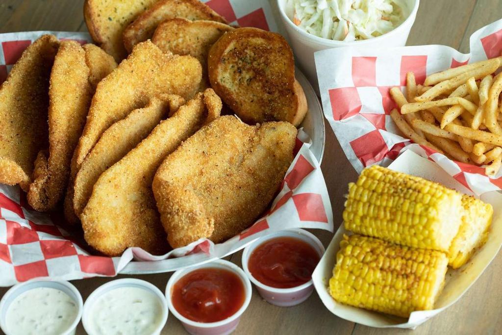 6 Fishes Family Combo · 6 pieces of your choice of fried catfish or tilapia. Served with 3 large sides, 4 Toast, and 4 Dips