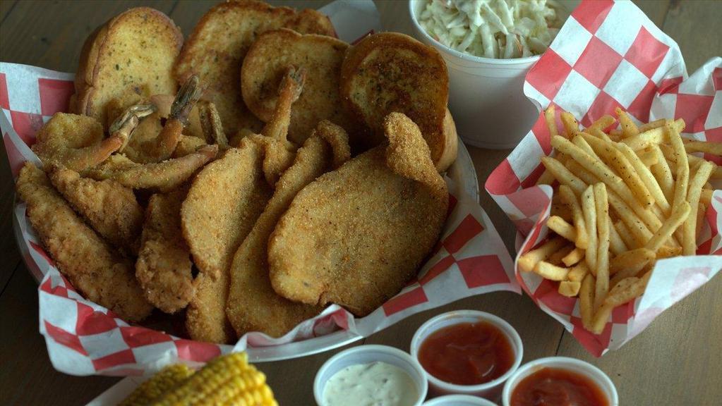 Family Meal Deal #1(3F/4T/6S) · 4 fried chicken tenders + 3 fried catfish or tilapia, and 6 fried shrimp. Served with 3 large sides, 4 Toast, and 4 Dips