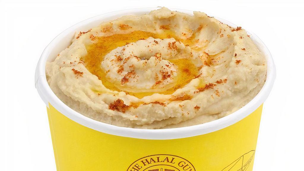 Hummus · The Mediterranean spread made from cooked, mashed chickpeas or other beans, blended with tahini, olive oil, lemon juice, salt, and garlic. Allergen: Contains Sesame