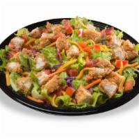 Crispy Chicken Salad · Romaine salad mix with red cabbage and carrots, bacon, shredded cheddar cheese, tomatoes and...