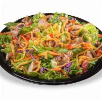 Grilled Chicken Salad · A generous portion of grilled chicken breast served on a crisp blend of iceberg lettuce. Top...