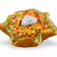 Taco Salad Chicken · Crispy tortilla bowl filled with sliced chicken breast, shredded cheddar cheese, crisp shred...