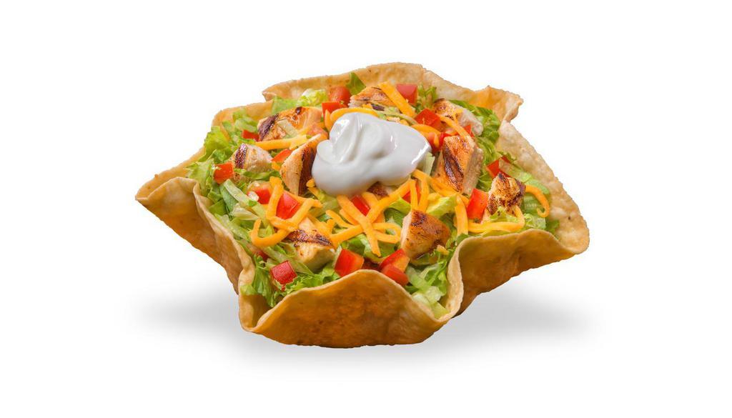 Chick'N Taco Salad · Crispy taco shell with beans, lettuce, tomatoes, shredded cheddar cheese, and chicken and choice of dressing (salsa, ranch, honey mustard, or Italian).