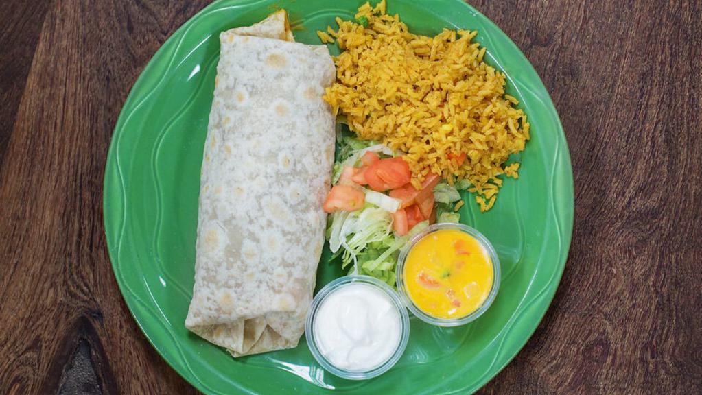 Fajita Burrito · Large flour tortilla filled with beans & choice of beef or chicken fajitas top with chili con queso.