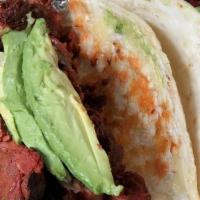Small Fajita Tacos · Al carbon with choice of beef or chicken fajitas and flour or corn. Served with rice and bea...