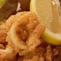 Fried Calamari · Fried squid calamari is quickly deep-fried keeping it crunchy on the outside and simply perf...