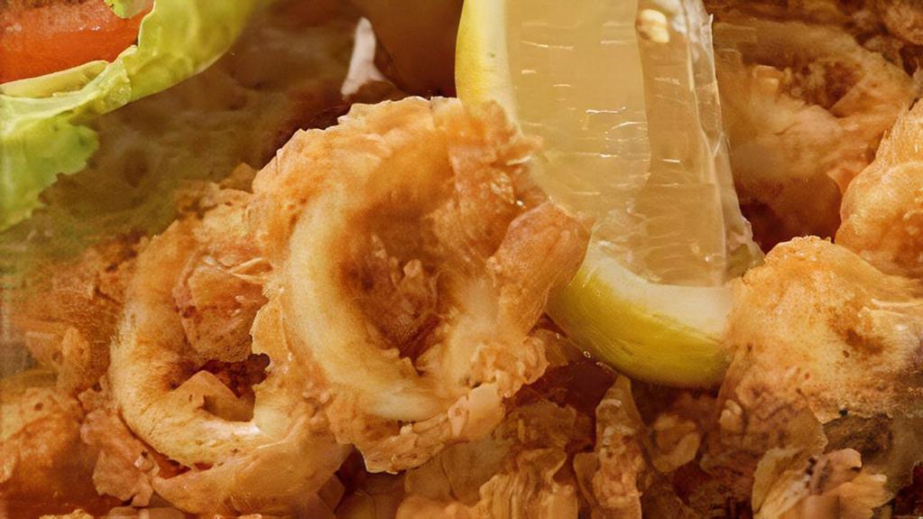 Fried Calamari · Fried squid calamari is quickly deep-fried keeping it crunchy on the outside and simply perfect on the inside. kick it up a notch with a squeeze of lemon.