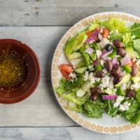 Greek Salad · Dinner sized salad garnished with Feta cheese and Kalamata olives and served with a zesty ho...