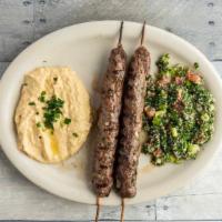 Kafta Plate · A blend of seasoned Ground Beef & Lamb mix and served skewer style, grilled. Served with Hum...