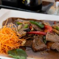 Pepper Steak · Slices of tender beef sauteed with onions, mushroom, carrot, bell peppers and black peppers.