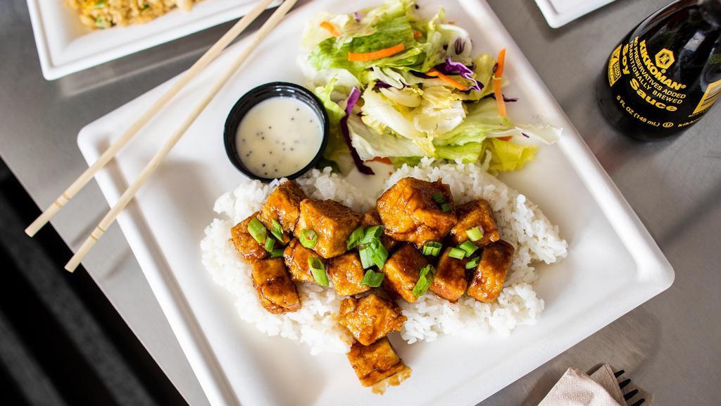 Tofu Teriyaki · Over a half pound of tofu, with a crunch outside and delicious inside, tossed in teriyaki sauce and served over a bed of rice with a side house salad.