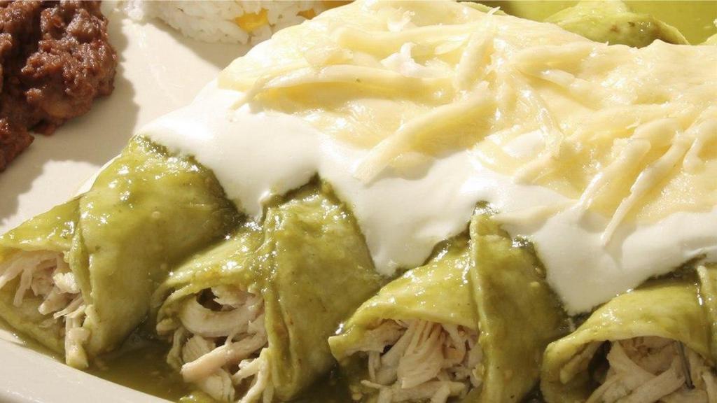 Enchiladas Suizas Family Pack · 16 Enchiladas Suizas with chicken, 
1 Lt. rice, 1 Lt. beans, sour cream 8oz. cheese, green sauce, chopped onion.
1 soft drink 2 Its.