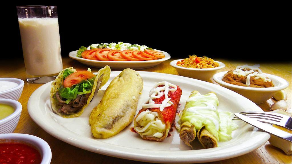 Mexican Plate · 1 chile relleno, 1 red enchilada, 1 alambre taco, 2 flautas, avocado sauce, rice