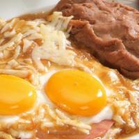 Rancheros Eggs · 2 Fried eggs over ham & corn tortilla, cover with sauce topped melted cheese, red or green c...