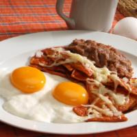 Ham & Eggs · 2 Scrambled eggs with ham & refried beans, red or green chilaquiles