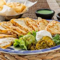 Quesadillas · Served with guacamole, sour cream, and jalapeños on the side.