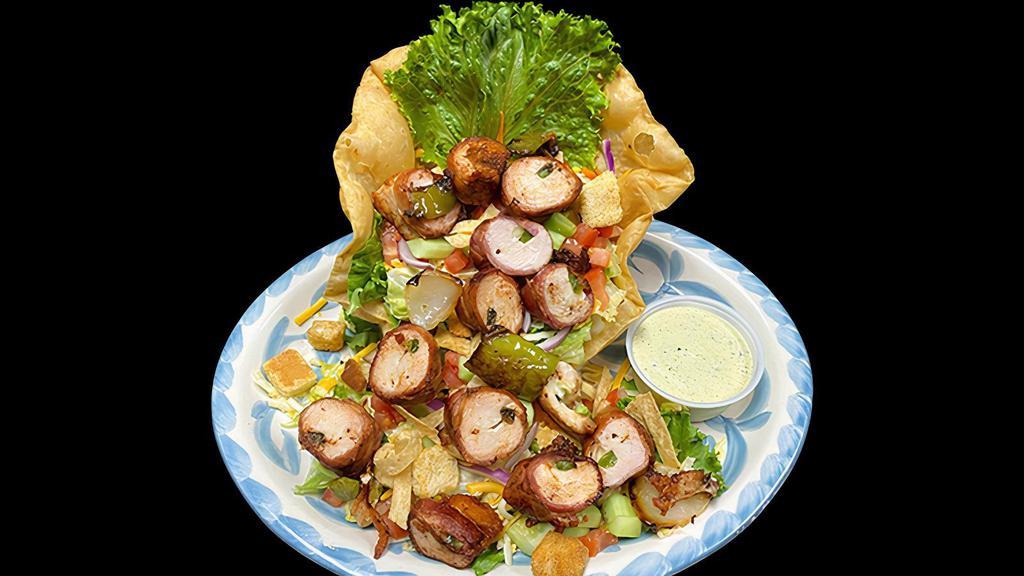 Chicken Diablo Salad · Chicken brochette style wrapped in bacon stuffed with jalapeños and Monterrey jack cheese served on top of lettuce, tomatoes, cheese, carrots, tortilla strips, cucumbers, and croutons.