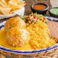 Stuffed Avocado Din · Avocado stuffed with your choice of fajita and jack cheese, fried and topped with queso. Ser...