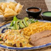 Cancun Chicken · Grilled chicken breast loaded with pico de gallo and smothered in queso served with sliced a...