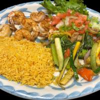 Grilled Shrimp · A skewer of six shrimp served with Mexican rice and grilled vegetables