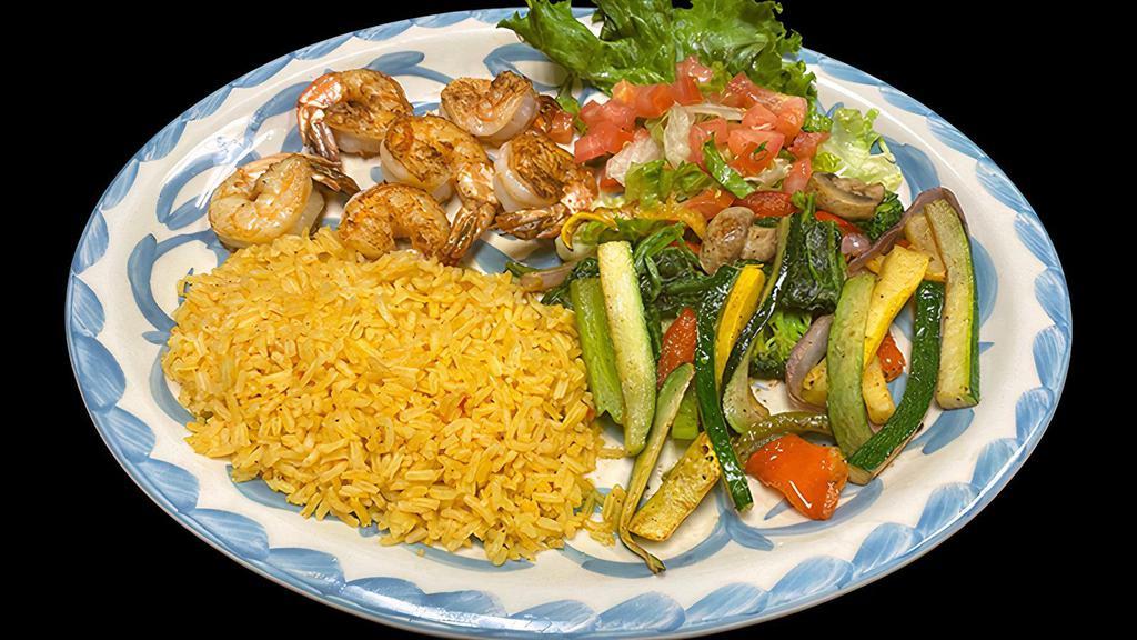 Grilled Shrimp · A skewer of six shrimp served with Mexican rice and grilled vegetables