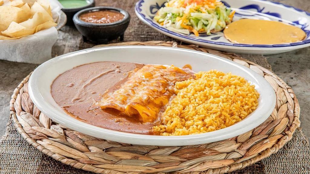 Fiesta Dinner · 2 Cheese enchiladas topped with chili con carne and grated cheese, ground beef taco, bean tostada, queso chip, guacamole, and your choice of beans & rice. (Refried beans and Mexican rice Default)