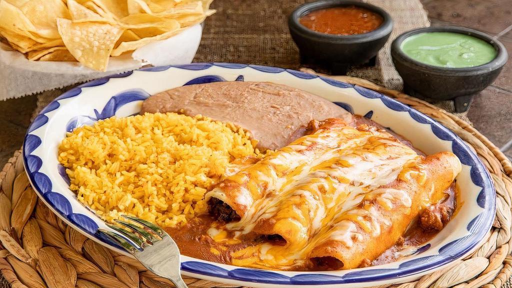 Cheese Enchilada Dinner · Cheese enchiladas topped with chili gravy and grated cheese, and your choice of beans & rice. (Refried beans and Mexican rice Default)