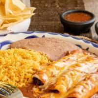 Chicken Enchilada Dinner · Shredded chicken enchiladas topped chili con carne and grated cheese and your choice beans &...