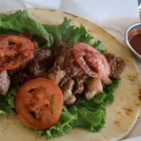 Wrap · Lettuce, onions, tomatoes all wrapped in Pita- served with white & red sauce. Add fries to w...