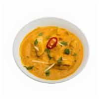 Chicken Korma · Boneless chicken in a gravy of crushed cashews and spicy masala. Spicy.