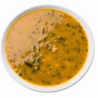 Dal Curry · Creamy lentils with onions and spices.