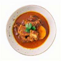 Lamb Curry  · Boneless lamb in a coconut milk gravy with spices