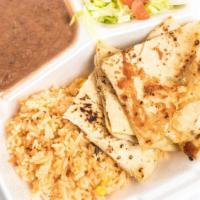 Quesadillas · Beef or chicken fajita with rice, sour cream, and guacamole.