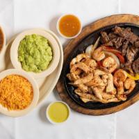 Parrillada Mix · Beef fajitas, chicken fajitas and shrimp served with a side of rice and guacamole.