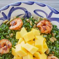 Kale & Mango · Vegan. Kale tossed in an agave-citrus dressing and topped with diced mango and roasted pepit...