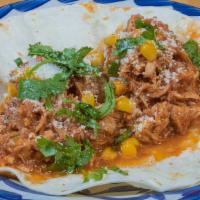 Smoked Chicken Elote · Slow cooked with adobe chipotles, grilled corn kernels, cotija cheese, cilantro, corn tortil...