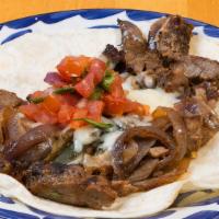 Beef Fajita · Citrus marinated grilled steak, roasted poblano peppers & grilled onions, Oaxaca cheese, pic...