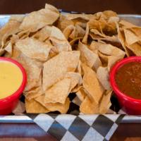 Queso, Salsa And Chips · Seasoned tortilla chips served with a bowl of queso & salsa.