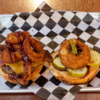 Texas Bbq Bacon Cheeseburger · All Beef patty on a brioche bun with BBQ sauce, Cheddar, Bacon, Onion rings and Pickle serve...