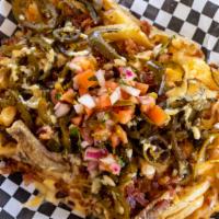 Bacon Queso Nachos, Fries Or Tots · Topped with Queso, Chopped bacon, Pickled jalapeños with a side of Ranch.