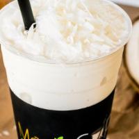Coconut Smoothie · Tropical coconut blended with ice, milk and real coconut flakes.