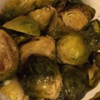 Brussels Sprouts · sautéed with white wine and apple wood bacon bits.