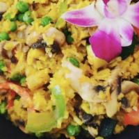 Vegetable Paella · zucchini, squash, bell peppers, mushrooms, green peas & saffron rice with a curry sauce.