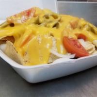 Nachos Supreme · With your choice of meat, onion, jalapeno, nachos, melty cheeses and sour cream.